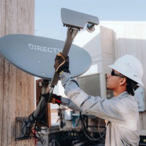 worker installing a satellite dish