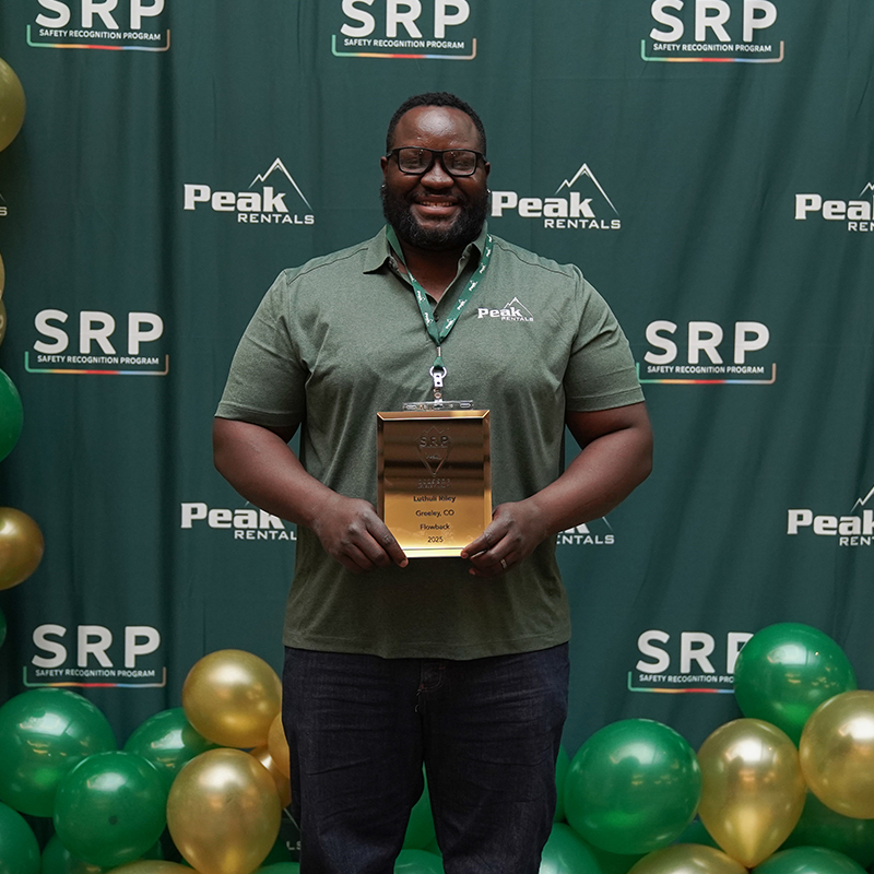 luthuli riley at SRP event holding award