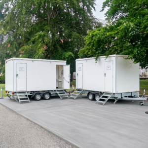 portable restroom trailers deployed on site render